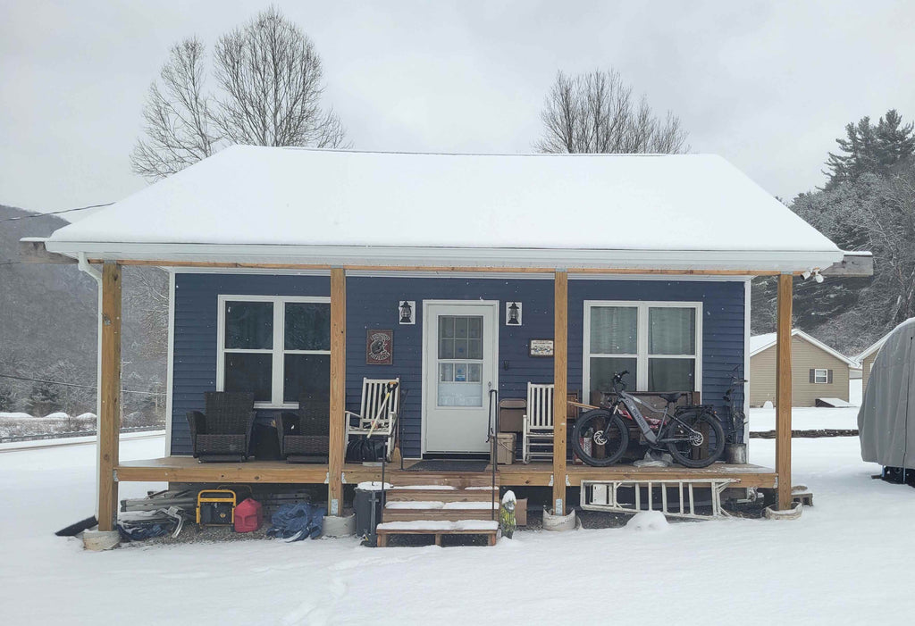 compact 1-bedroom home with master suite, open floor plan, and porch