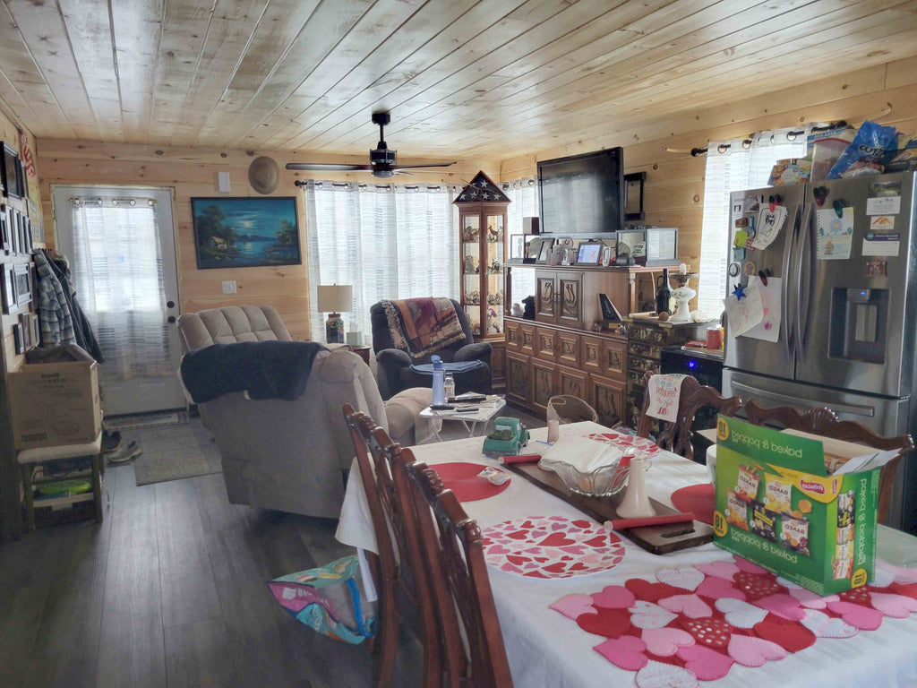 compact 1-bedroom home with master suite, open floor plan, and porch