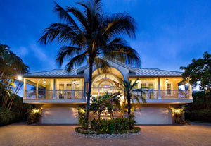 Three-Story Coastal Luxury Home with Balconies, Lanai, and Outdoor Kitchen
