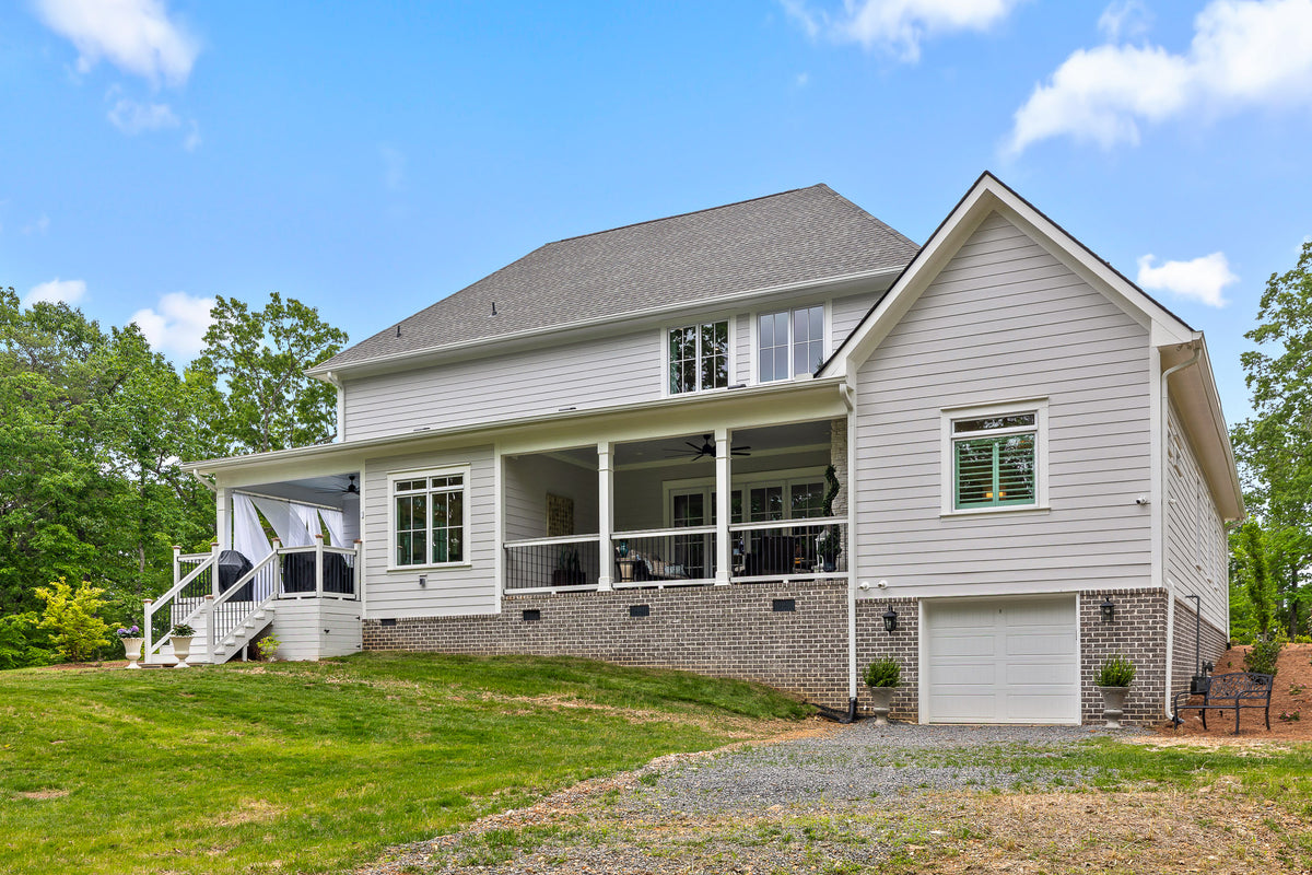 Luxury 4-Bedroom House Plan with Bonus Room and Sunroom